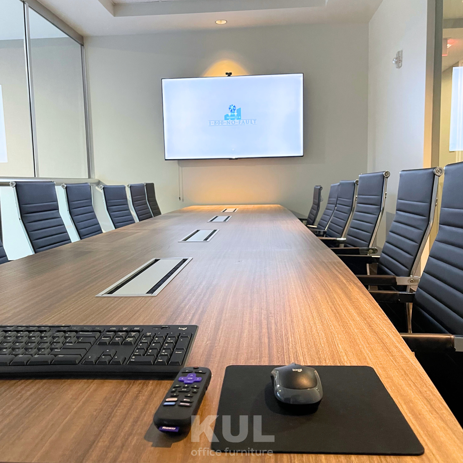 Power strip in center of boat shape conference table